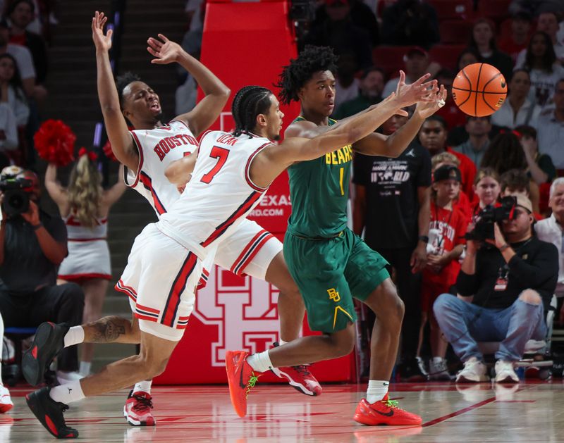 Feb 10, 2025; Houston, Texas, USA; Houston Cougars guard Milos Uzan (7) defense against Baylor Bears guard Robert Wright III (1) in the first half at Fertitta Center. Mandatory Credit: Thomas Shea-Imagn Images