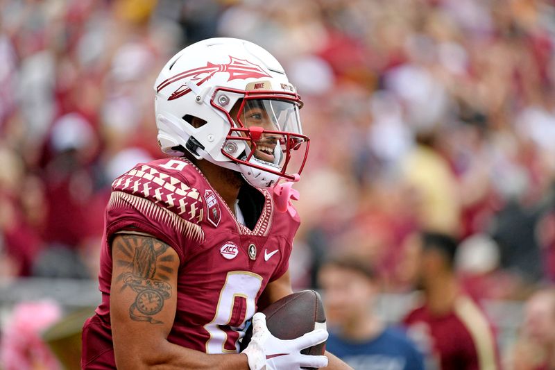 Oct 29, 2022; Tallahassee, Florida, USA; Florida State Seminoles wide receiver Ja'Khi Douglas (0) celebrates a touchdown during the game against the Georgia Tech Yellow Jackets at Doak S. Campbell Stadium. Mandatory Credit: Melina Myers-USA TODAY Sports