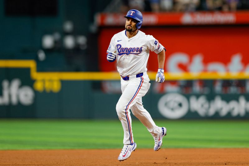 May 15, 2024; Arlington, Texas, USA; Texas Rangers second base Marcus Semien (2) hits a two-run home run during the fifth inning against the Cleveland Guardians at Globe Life Field. Mandatory Credit: Andrew Dieb-USA TODAY Sports