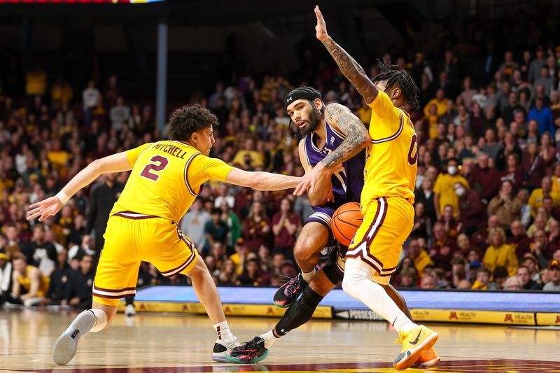 Feb 3, 2024; Minneapolis, Minnesota, USA; Northwestern Wildcats guard Boo Buie (0) drives as Minnesota Golden Gophers guard Mike Mitchell Jr. (2) and guard Elijah Hawkins (0) defend during overtime at Williams Arena. Mandatory Credit: Matt Krohn-USA TODAY Sports