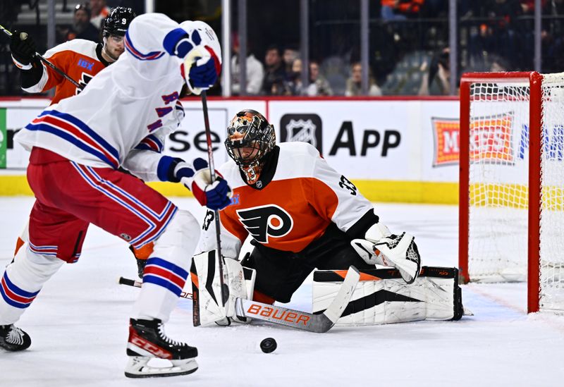 Feb 24, 2024; Philadelphia, Pennsylvania, USA; Philadelphia Flyers goalie Samuel Ersson (33) defends a shot against the New York Rangers in the second period at Wells Fargo Center. Mandatory Credit: Kyle Ross-USA TODAY Sports