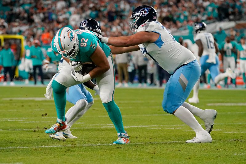 Miami Dolphins defensive tackle Zach Sieler (92) intercept a pass by Tennessee Titans quarterback Will Levis during the first half of an NFL football game, Monday, Dec. 11, 2023, in Miami, Fla. Sieler scored a touchdown on the play. (AP Photo/Lynne Sladky)