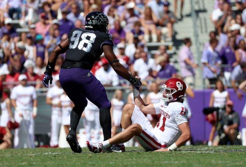 Oct 1, 2022; Fort Worth, Texas, USA; TCU Horned Frogs defensive lineman Dylan Horton (98) helps up Oklahoma Sooners quarterback Davis Beville (11) during the second half at Amon G. Carter Stadium. Mandatory Credit: Kevin Jairaj-USA TODAY Sports