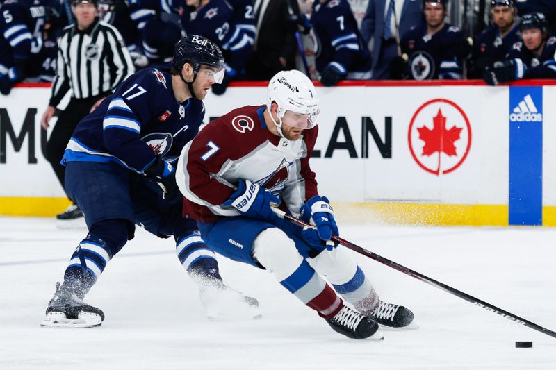 Apr 23, 2024; Winnipeg, Manitoba, CAN; Colorado Avalanche defenseman Devon Toews (7) turns on Winnipeg Jets forward Adam Lowry (17) during the second period in game two of the first round of the 2024 Stanley Cup Playoffs at Canada Life Centre. Mandatory Credit: Terrence Lee-USA TODAY Sports