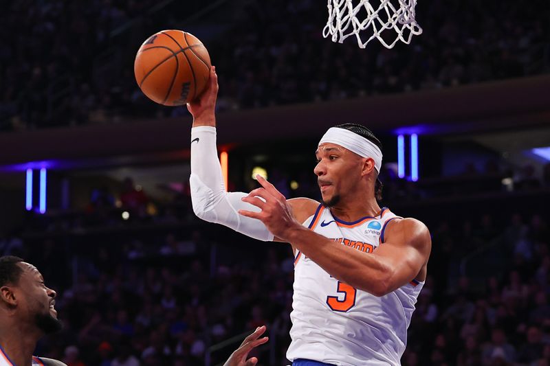 NEW YORK, NEW YORK - DECEMBER 25:  Josh Hart #3 of the New York Knicks passes the ball during the first quarter of the game against the Milwaukee Bucks at Madison Square Garden on December 25, 2023 in New York City.  NOTE TO USER: User expressly acknowledges and agrees that, by downloading and or using this photograph, User is consenting to the terms and conditions of the Getty Images License Agreement. (Photo by Rich Graessle/Getty Images)