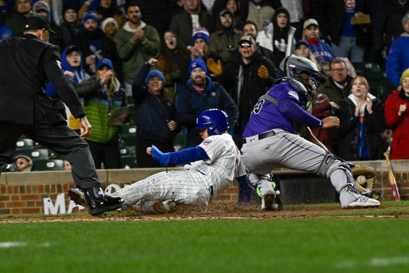 Apr 2, 2024; Chicago, Illinois, USA; Chicago Cubs left fielder Ian Happ (8) scores against the Colorado Rockies during the third inning at Wrigley Field. Mandatory Credit: Matt Marton-USA TODAY Sports