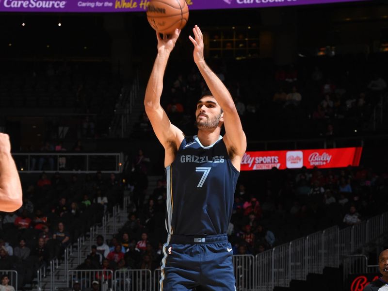 ATLANTA, GA - OCTOBER 12: Santi Aldama #7 of the Memphis Grizzlies shoots a three point basket during the preseason game on October 12, 2023 at State Farm Arena in Atlanta, Georgia.  NOTE TO USER: User expressly acknowledges and agrees that, by downloading and/or using this Photograph, user is consenting to the terms and conditions of the Getty Images License Agreement. Mandatory Copyright Notice: Copyright 2023 NBAE (Photo by Scott Cunningham/NBAE via Getty Images)