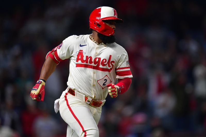 May 27, 2025; Anaheim, California, USA; Los Angeles Angels second baseman Luis Rengifo (2) hits a single against the New York Yankees during the ninth inning at Angel Stadium. Mandatory Credit: Gary A. Vasquez-Imagn Images
