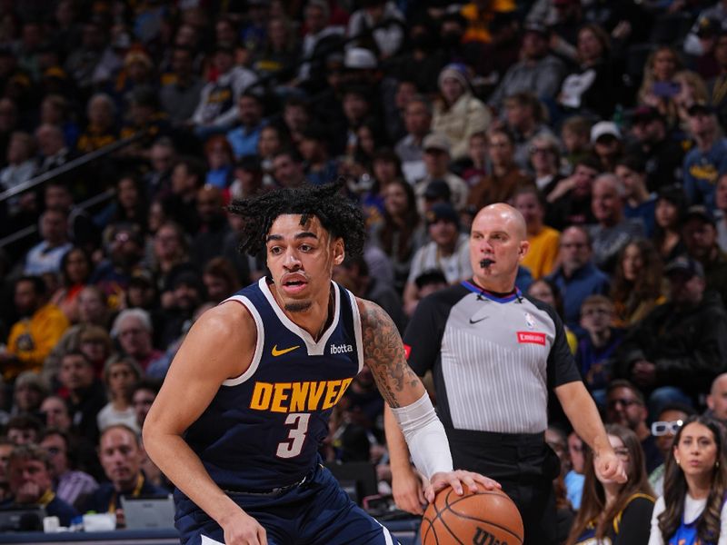 DENVER, CO - MARCH 25: Julian Strawther #3 of the Denver Nuggets handles the ball during the game against the Memphis Grizzlies on March 25, 2024 at the Ball Arena in Denver, Colorado. NOTE TO USER: User expressly acknowledges and agrees that, by downloading and/or using this Photograph, user is consenting to the terms and conditions of the Getty Images License Agreement. Mandatory Copyright Notice: Copyright 2024 NBAE (Photo by Bart Young/NBAE via Getty Images)