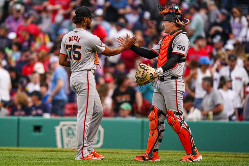 May 2, 2024; Boston, Massachusetts, USA; San Francisco Giants relief pitcher Camilo Doval (75) is congratulated by catcher Patrick Bailey (14) after defeating the Boston Red Sox in nine innings at Fenway Park. Mandatory Credit: David Butler II-USA TODAY Sports