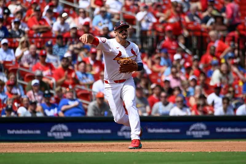 Aug 18, 2024; St. Louis, Missouri, USA; St. Louis Cardinals third baseman Nolan Arenado (28) throws to first for an out against the Los Angeles Dodgers in the fifth inning at Busch Stadium. Mandatory Credit: Joe Puetz-USA TODAY Sports