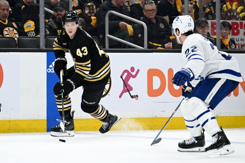 Apr 22, 2024; Boston, Massachusetts, USA; Boston Bruins center Danton Heinen (43) skates against Toronto Maple Leafs defenseman Jake McCabe (22) during the first period in game two of the first round of the 2024 Stanley Cup Playoffs at TD Garden. Mandatory Credit: Brian Fluharty-USA TODAY Sports