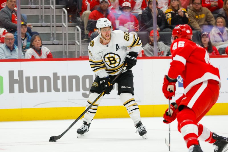 Dec 31, 2023; Detroit, Michigan, USA; Boston Bruins right wing David Pastrnak (88) handles the puck during the third period of the game between the Boston Bruins and the Detroit Red Wings at Little Caesars Arena. Mandatory Credit: Brian Bradshaw Sevald-USA TODAY Sports