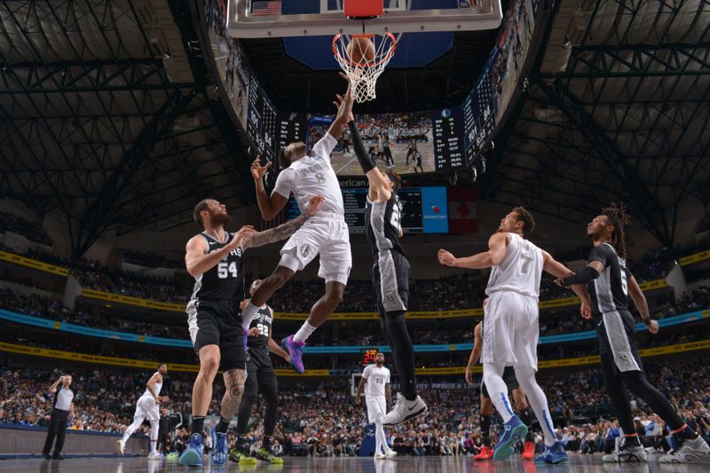 DALLAS, TX - NOVEMBER 16: Olivier Maxence-Prosper #8 of the Dallas Mavericks drives to the basket during the game against the San Antonio Spurs on November 16, 2024 at American Airlines Center in Dallas, Texas. NOTE TO USER: User expressly acknowledges and agrees that, by downloading and or using this photograph, User is consenting to the terms and conditions of the Getty Images License Agreement. Mandatory Copyright Notice: Copyright 2024 NBAE (Photo by Glenn James/NBAE via Getty Images)