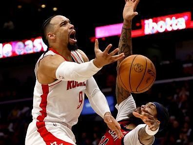 NEW ORLEANS, LOUISIANA - DECEMBER 23: Dillon Brooks #9 of the Houston Rockets is fouled by Brandon Ingram #14 of the New Orleans Pelicans during the third quarter of an NBA game at Smoothie King Center on December 23, 2023 in New Orleans, Louisiana. NOTE TO USER: User expressly acknowledges and agrees that, by downloading and or using this photograph, User is consenting to the terms and conditions of the Getty Images License Agreement. (Photo by Sean Gardner/Getty Images)