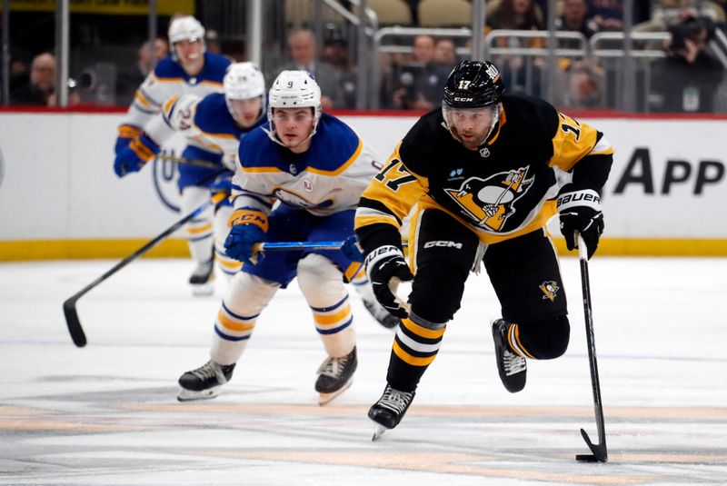 Jan 6, 2024; Pittsburgh, Pennsylvania, USA;  Pittsburgh Penguins right wing Bryan Rust (17) skates up ice with the puck against the Buffalo Sabres during the third period at PPG Paints Arena. Buffalo won 3-1. Mandatory Credit: Charles LeClaire-USA TODAY Sports