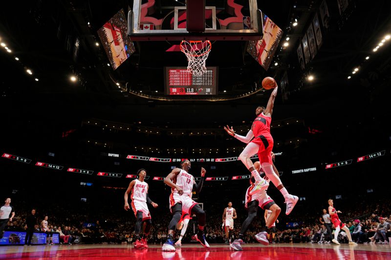 TORONTO, CANADA - JANUARY 17: Immanuel Quickley #5 of the Toronto Raptors drives to the basket during the game against the Miami Heat on January 17, 2024 at the Scotiabank Arena in Toronto, Ontario, Canada.  NOTE TO USER: User expressly acknowledges and agrees that, by downloading and or using this Photograph, user is consenting to the terms and conditions of the Getty Images License Agreement.  Mandatory Copyright Notice: Copyright 2024 NBAE (Photo by Mark Blinch/NBAE via Getty Images)