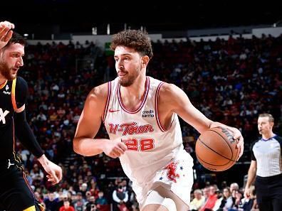 HOUSTON, TX - DECEMBER 27:   Alperen Sengun #28 of the Houston Rockets drives to the basket during the game against the Phoenix Suns on December 27, 2023 at the Toyota Center in Houston, Texas. NOTE TO USER: User expressly acknowledges and agrees that, by downloading and or using this photograph, User is consenting to the terms and conditions of the Getty Images License Agreement. Mandatory Copyright Notice: Copyright 2023 NBAE (Photo by Logan Riely/NBAE via Getty Images)