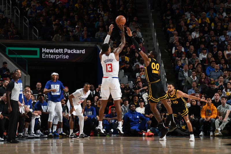 SAN FRANCISCO, CA - FEBRUARY 14: Paul George #13 of the LA Clippers shoots a three point basket against the Golden State Warriors on FEBRUARY 14, 2024 at Chase Center in San Francisco, California. NOTE TO USER: User expressly acknowledges and agrees that, by downloading and or using this photograph, user is consenting to the terms and conditions of Getty Images License Agreement. Mandatory Copyright Notice: Copyright 2024 NBAE (Photo by Noah Graham/NBAE via Getty Images)