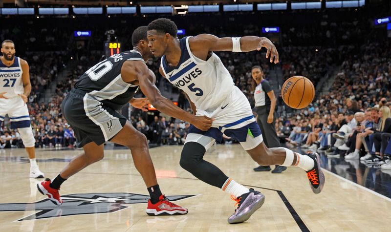 SAN ANTONIO, TX - NOVEMBER 2:  Anthony Edwards #5 of the Minnesota Timberwolves is stripped of the ball by Harrison Barnes #40 of the San Antonio Spurs in the first half at Frost Bank Center on November 2, 2024 in San Antonio, Texas. NOTE TO USER: User expressly acknowledges and agrees that, by downloading and or using this photograph, User is consenting to terms and conditions of the Getty Images License Agreement. (Photo by Ronald Cortes/Getty Images)