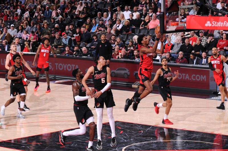 PORTLAND, OR - APRIL 12: Amen Thompson #1 of the Houston Rockets drives to the basket during the game against the Portland Trail Blazers on April 12, 2024 at the Moda Center Arena in Portland, Oregon. NOTE TO USER: User expressly acknowledges and agrees that, by downloading and or using this photograph, user is consenting to the terms and conditions of the Getty Images License Agreement. Mandatory Copyright Notice: Copyright 2024 NBAE (Photo by Cameron Browne/NBAE via Getty Images)