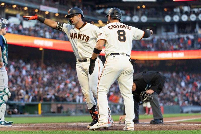 Jul 3, 2023; San Francisco, California, USA;  San Francisco Giants catcher Blake Sabol (2) celebrates with right fielder Michael Conforto (8) after hitting a two run home run during the fourth inning against the Seattle Mariners at Oracle Park. Mandatory Credit: Stan Szeto-USA TODAY Sports