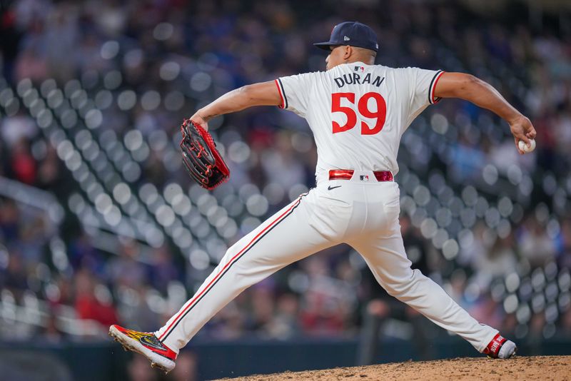 May 28, 2024; Minneapolis, Minnesota, USA; Minnesota Twins pitcher Jhoan Duran (59) pitches against the Kansas City Royals in the ninth inning at Target Field. Mandatory Credit: Brad Rempel-USA TODAY Sports