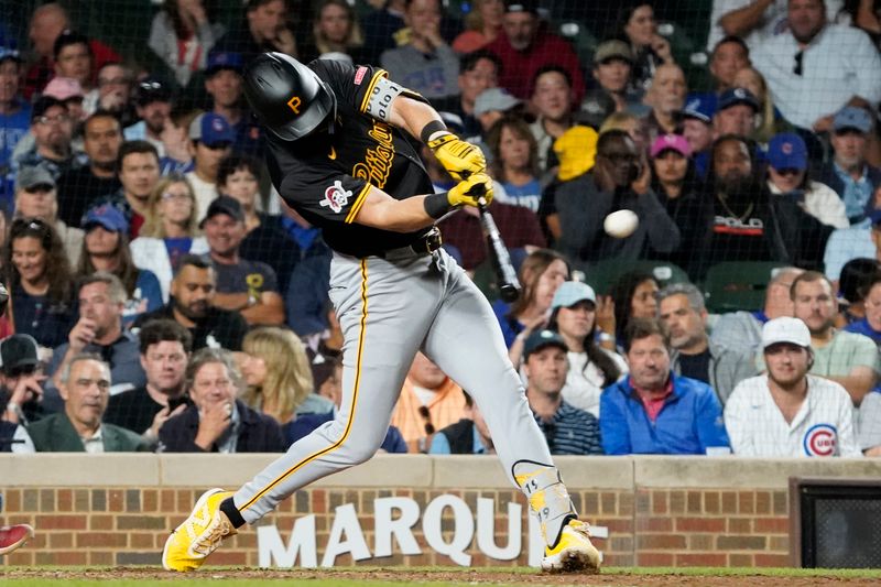 Sep 3, 2024; Chicago, Illinois, USA; Pittsburgh Pirates third baseman Jared Triolo (19) hits a three-run home run against the Chicago Cubs during the seventh inning at Wrigley Field. Mandatory Credit: David Banks-Imagn Images