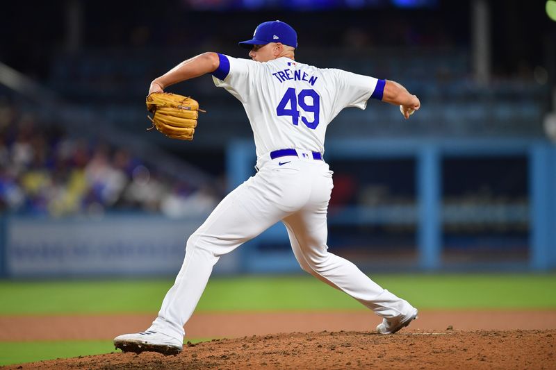 Aug 29, 2024; Los Angeles, California, USA; Los Angeles Dodgers pitcher Blake Treinen (49) throws against the Baltimore Orioles during the seventh inning at Dodger Stadium. Mandatory Credit: Gary A. Vasquez-USA TODAY Sports
