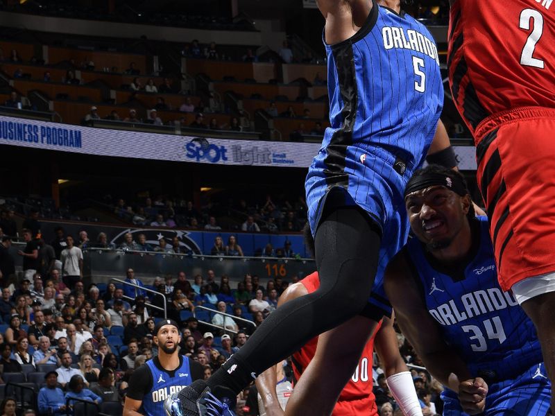 ORLANDO, FL - APRIL 1: Paolo Banchero #5 of the Orlando Magic drives to the basket during the game against the Portland Trail Blazers on April 1, 2024 at Kia Center in Orlando, Florida. NOTE TO USER: User expressly acknowledges and agrees that, by downloading and or using this photograph, User is consenting to the terms and conditions of the Getty Images License Agreement. Mandatory Copyright Notice: Copyright 2024 NBAE (Photo by Fernando Medina/NBAE via Getty Images)