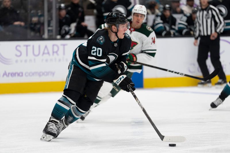 Nov 7, 2024; San Jose, California, USA;  San Jose Sharks left wing Fabian Zetterlund (20) controls the puck during the third period against the Minnesota Wild at SAP Center at San Jose. Mandatory Credit: Stan Szeto-Imagn Images