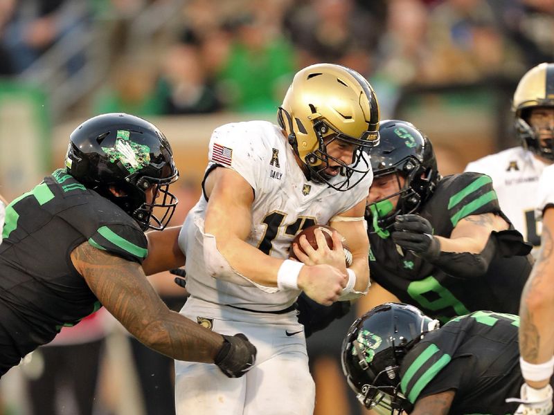 Nov 9, 2024; Denton, Texas, USA; Army Black Knights quarterback Bryson Daily (13) runs the ball against the North Texas Mean Green during the second half at DATCU Stadium. Mandatory Credit: Danny Wild-Imagn Images