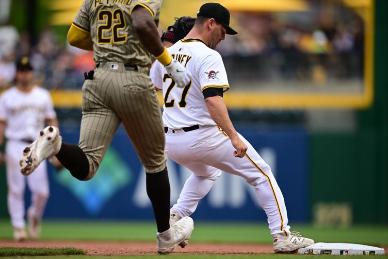 May 4, 2025; Pittsburgh, Pennsylvania, USA; Pittsburgh Pirates relief pitcher Tanner Rainey (27) forces out San Diego Padres left fielder Jason Heyward (22) during the seventh inning at PNC Park. Mandatory Credit: David Dermer-Imagn Images