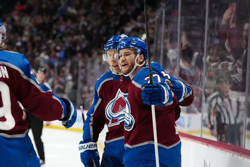 Jan 2, 2024; Denver, Colorado, USA; Colorado Avalanche left wing Jonathan Drouin (27) celebrates his goal with defenseman Jack Johnson (3) in the second period against the New York Islanders at Ball Arena. Mandatory Credit: Ron Chenoy-USA TODAY Sports