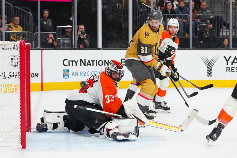 Jan 19, 2026; Las Vegas, Nevada, USA; Philadelphia Flyers goaltender Samuel Ersson (33) watches the puck deflect off the post as Vegas Golden Knights right wing Mark Stone (61) looks for a rebound during the first period at T-Mobile Arena. Mandatory Credit: Stephen R. Sylvanie-Imagn Images