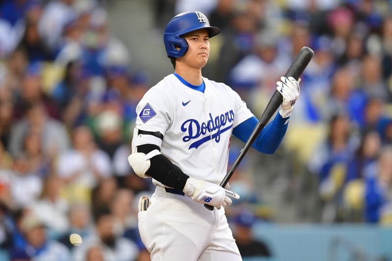 May 22, 2024; Los Angeles, California, USA; Los Angeles Dodgers designated hitter Shohei Ohtani (17) on deck before hitting against the Arizona Diamondbacks during the first inning at Dodger Stadium. Mandatory Credit: Gary A. Vasquez-USA TODAY Sports