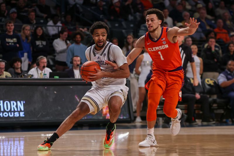 Feb 21, 2024; Atlanta, Georgia, USA; Georgia Tech Yellow Jackets guard Kyle Sturdivant (1) drives past Clemson Tigers guard Chase Hunter (1) in the second half at McCamish Pavilion. Mandatory Credit: Brett Davis-USA TODAY Sports