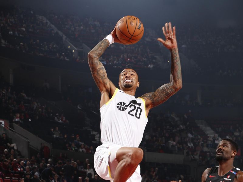 PORTLAND, OR - DECEMBER 6: John Collins #20 of the Utah Jazz drives to the basket during the game against the Portland Trail Blazers on December 6, 2024 at the Moda Center Arena in Portland, Oregon. NOTE TO USER: User expressly acknowledges and agrees that, by downloading and or using this photograph, user is consenting to the terms and conditions of the Getty Images License Agreement. Mandatory Copyright Notice: Copyright 2024 NBAE (Photo by Cameron Browne/NBAE via Getty Images)