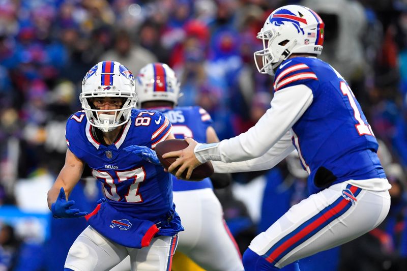 Buffalo Bills quarterback Josh Allen (17) fakes a hand off to wide receiver Andy Isabella (87) during the first half of an NFL wild-card playoff football game against the Pittsburgh Steelers in Orchard Park, N.Y., Monday, Jan. 15, 2024. (AP Photo/Adrian Kraus)