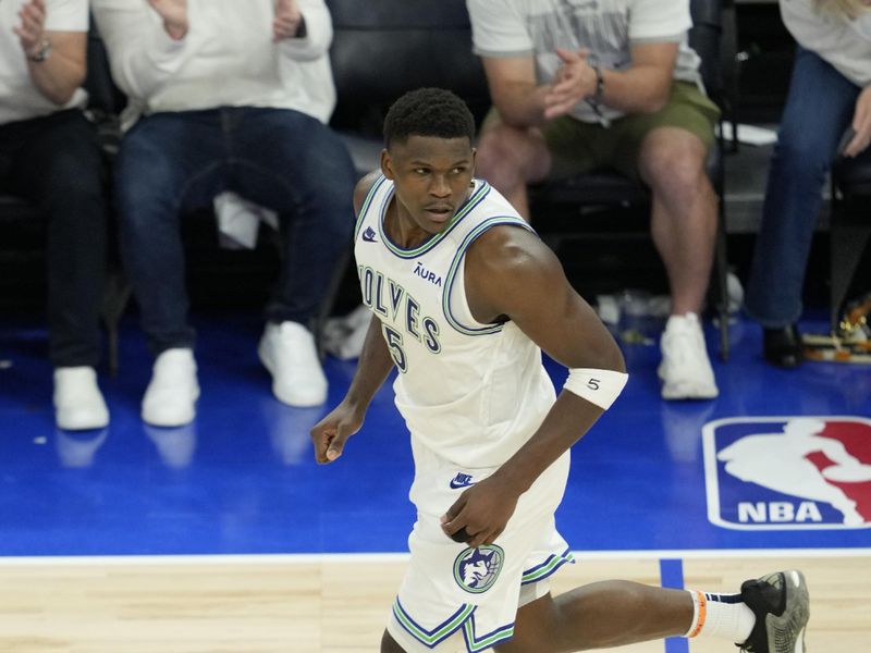 MINNEAPOLIS, MN -  MAY 16: Anthony Edwards #5 of the Minnesota Timberwolves looks on during the game against the Denver Nuggets during Round 2 Game 6 of the 2024 NBA Playoffs on May 16, 2024 at Target Center in Minneapolis, Minnesota. NOTE TO USER: User expressly acknowledges and agrees that, by downloading and or using this Photograph, user is consenting to the terms and conditions of the Getty Images License Agreement. Mandatory Copyright Notice: Copyright 2024 NBAE (Photo by Jordan Johnson/NBAE via Getty Images)