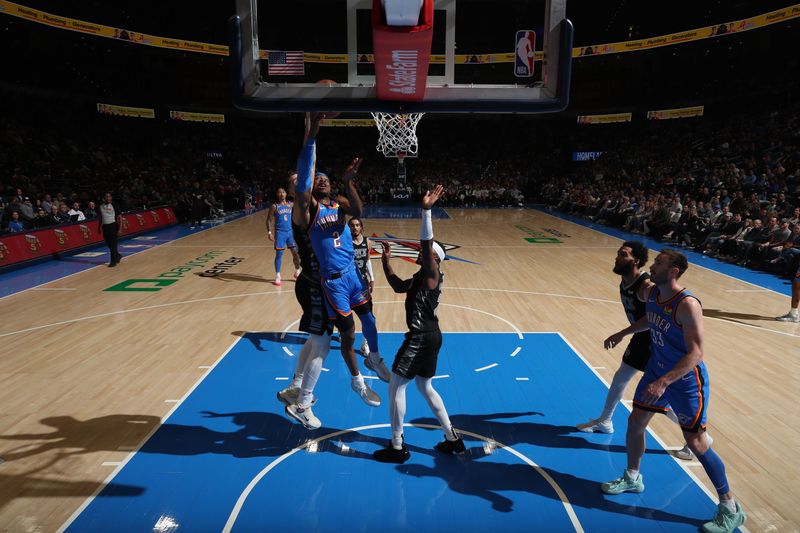 OKLAHOMA CITY, OK - APRIL 10:  Shai Gilgeous-Alexander #2 of the Oklahoma City Thunder drives to the basket during the game against the San Antonio Spurs on April 10, 2024 at Paycom Arena in Oklahoma City, Oklahoma. NOTE TO USER: User expressly acknowledges and agrees that, by downloading and or using this photograph, User is consenting to the terms and conditions of the Getty Images License Agreement. Mandatory Copyright Notice: Copyright 2024 NBAE (Photo by Zach Beeker/NBAE via Getty Images)