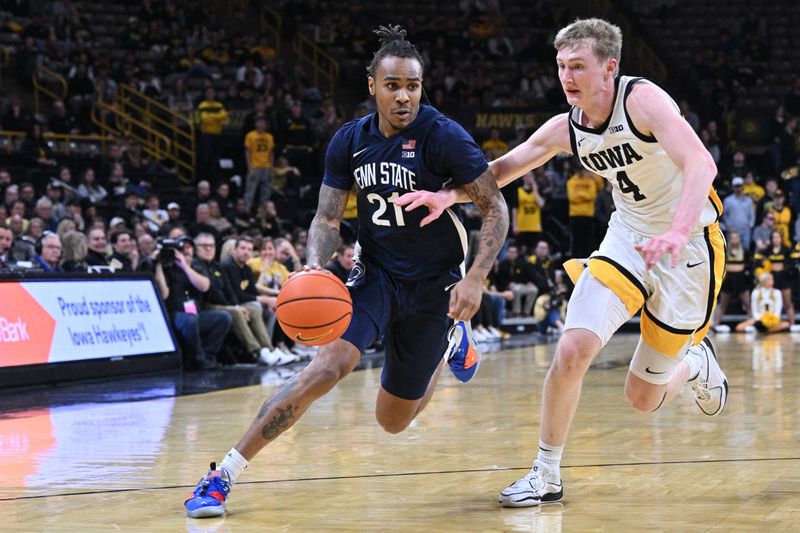 Feb 27, 2024; Iowa City, Iowa, USA; Penn State Nittany Lions guard RayQuawndis Mitchell (21) controls the ball as Iowa Hawkeyes guard Josh Dix (4) defends during the first half at Carver-Hawkeye Arena. Mandatory Credit: Jeffrey Becker-USA TODAY Sports