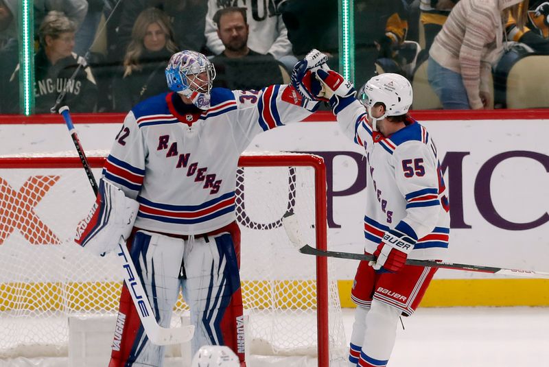 Nov 22, 2023; Pittsburgh, Pennsylvania, USA; New York Rangers goaltender Jonathan Quick (32) and defenseman Ryan Lindgren (55) celebrate after defeating the Pittsburgh Penguins at PPG Paints Arena. The Rangers won 1-0. Mandatory Credit: Charles LeClaire-USA TODAY Sports