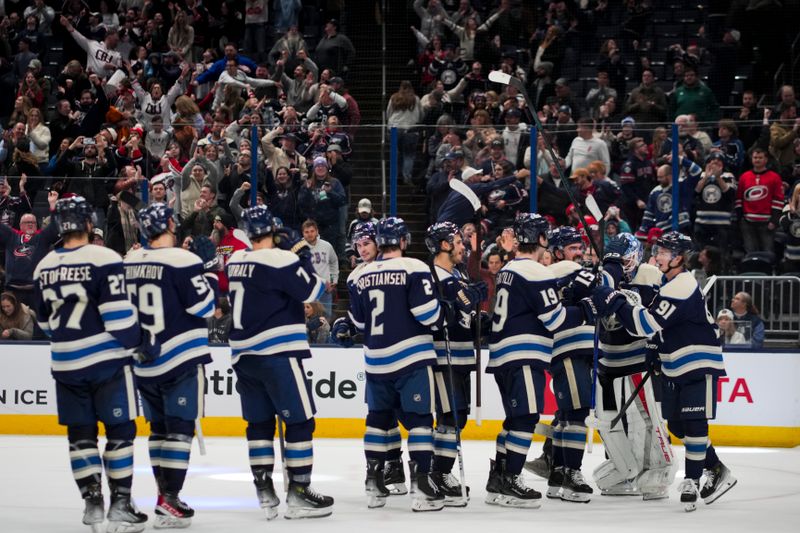 Nov 23, 2024; Columbus, Ohio, USA;  The Columbus Blue Jackets celebrate after defeating the Carolina Hurricanes in a shootout at Nationwide Arena. Mandatory Credit: Aaron Doster-Imagn Images