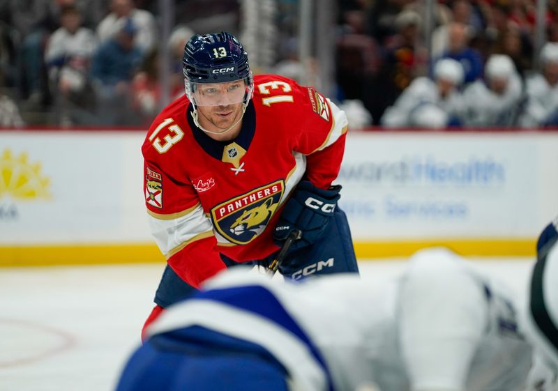 Dec 27, 2025; Sunrise, Florida, USA; Florida Panthers center Sam Reinhart (13) waits for a face-off against the Tampa Bay Lightning during the first period at Amerant Bank Arena. Mandatory Credit: Jeff Romance-Imagn Images