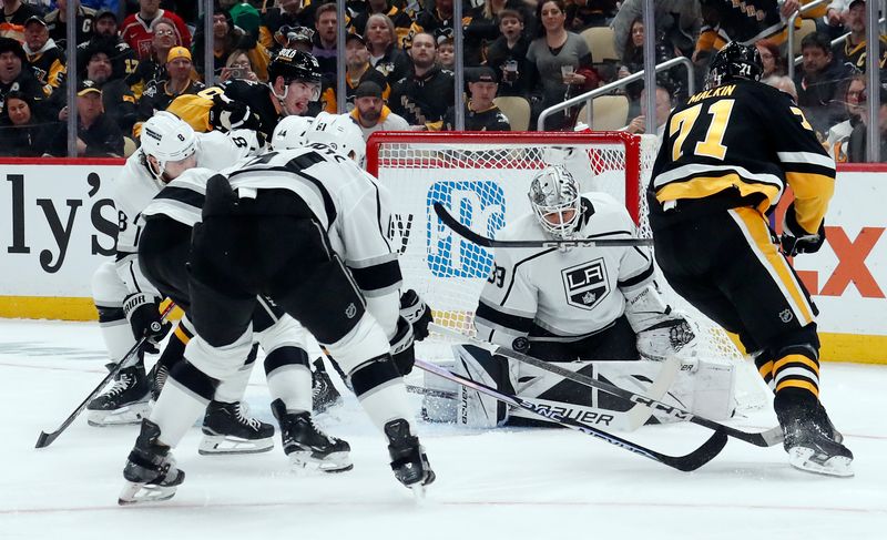 Feb 18, 2024; Pittsburgh, Pennsylvania, USA;  Los Angeles Kings goaltender Cam Talbot (39) makes a save against Pittsburgh Penguins center Evgeni Malkin (71) during the first period at PPG Paints Arena. Mandatory Credit: Charles LeClaire-USA TODAY Sports