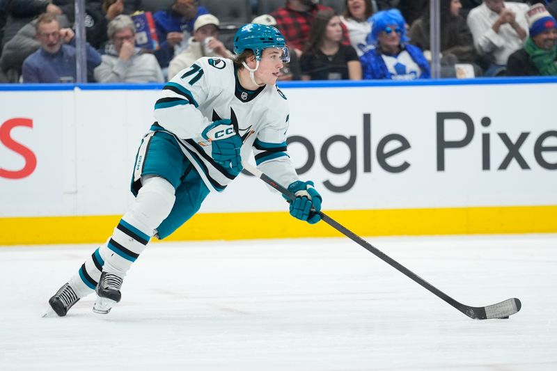 Dec 11, 2025; Toronto, Ontario, CAN; San Jose Sharks forward Macklin Celebrini (71) carries the puck against the Toronto Maple Leafs during the third period at Scotiabank Arena. Mandatory Credit: John E. Sokolowski-Imagn Images Dec 11, 2025; Toronto, Ontario, CAN; San Jose Sharks forward Macklin Celebrini (71) carries the puck against the Toronto Maple Leafs during the third period at Scotiabank Arena. Mandatory Credit: John E. Sokolowski-Imagn Images