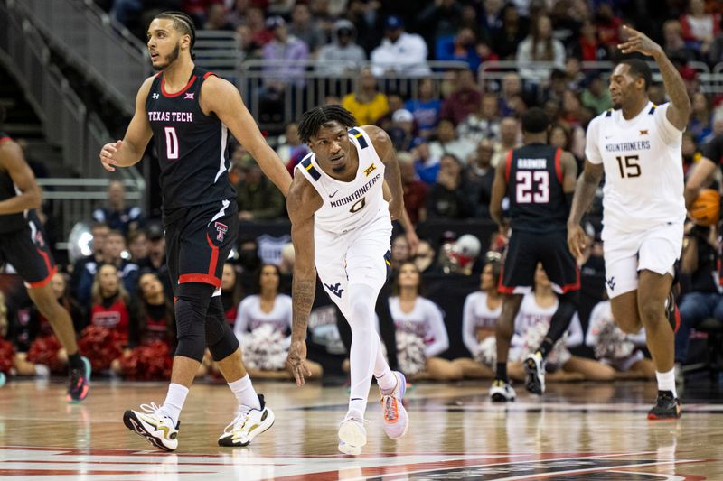 Mar 8, 2023; Kansas City, MO, USA; West Virginia Mountaineers guard Kedrian Johnson (0) celebrates a made three-point shot against the Texas Tech Red Raiders in the first half at T-Mobile Center. Mandatory Credit: Amy Kontras-USA TODAY Sports