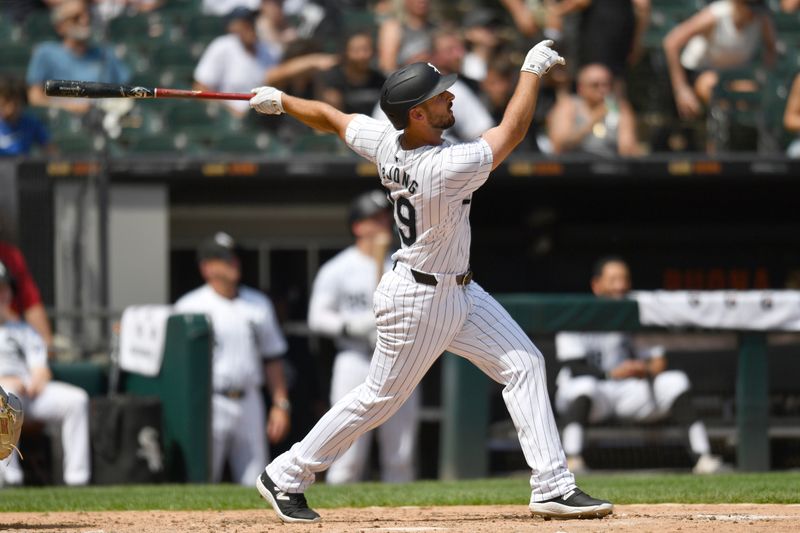 Jun 29, 2024; Chicago, Illinois, USA; Chicago White Sox shortstop Paul DeJong (29) hits a two-run home run during the sixth inning against the Colorado Rockies at Guaranteed Rate Field. Mandatory Credit: Patrick Gorski-USA TODAY Sports