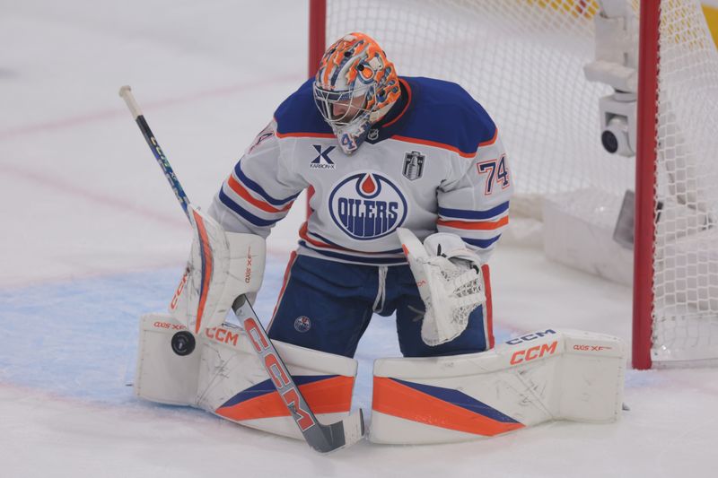 Jun 9, 2025; Sunrise, Florida, USA; Edmonton Oilers goaltender Stuart Skinner (74) blocks a shot on goal during the second period against the Florida Panthers in game three of the 2025 Stanley Cup Final at Amerant Bank Arena. Mandatory Credit: Sam Navarro-Imagn Images
